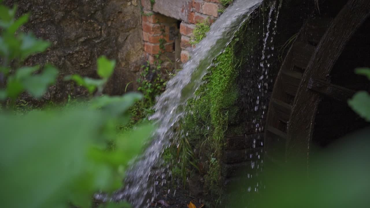 Watermill in picnic park detail water