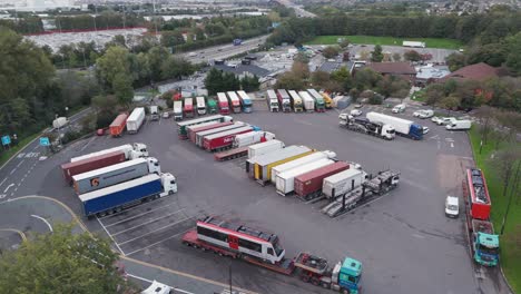 aerial orbital view of gordano motorway services showing truck parking area, service facilities and vehicle arrangement, bristol, uk, october 2024