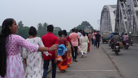 gathering of people and tarpan at dakshineswar temple in kolkata on mahalaya day on the eve of durga puja.