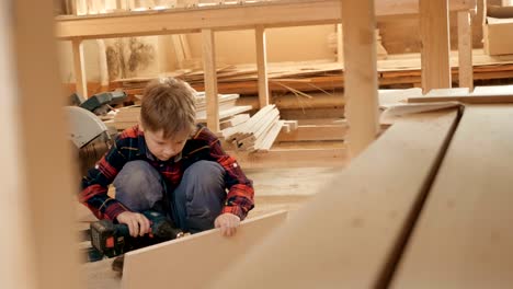 portrait of a child in a carpentry workshop.