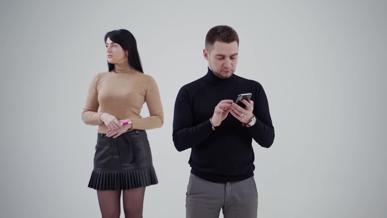 Successful young business partners. Young business couple standing in studio