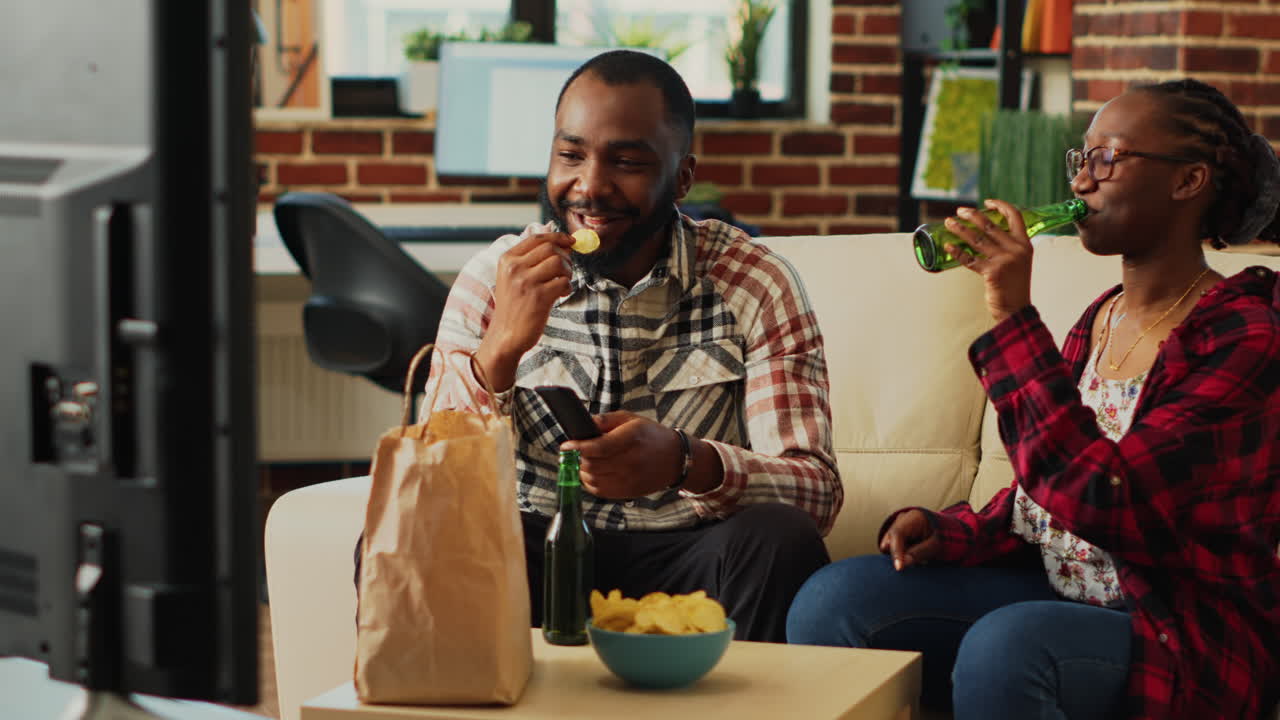African american couple unpacking delivery meal