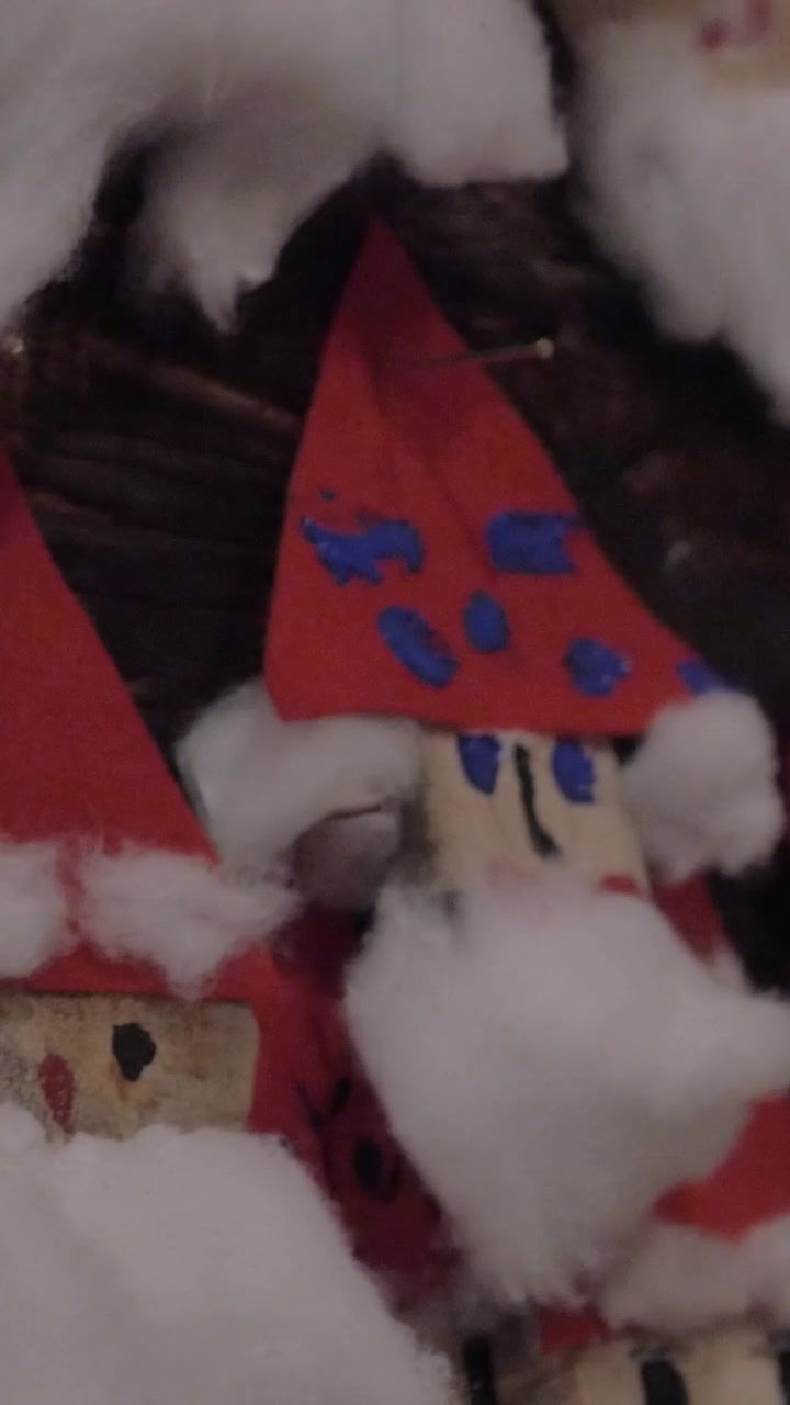 Placing Santa Claus craftwork into Christmas collection