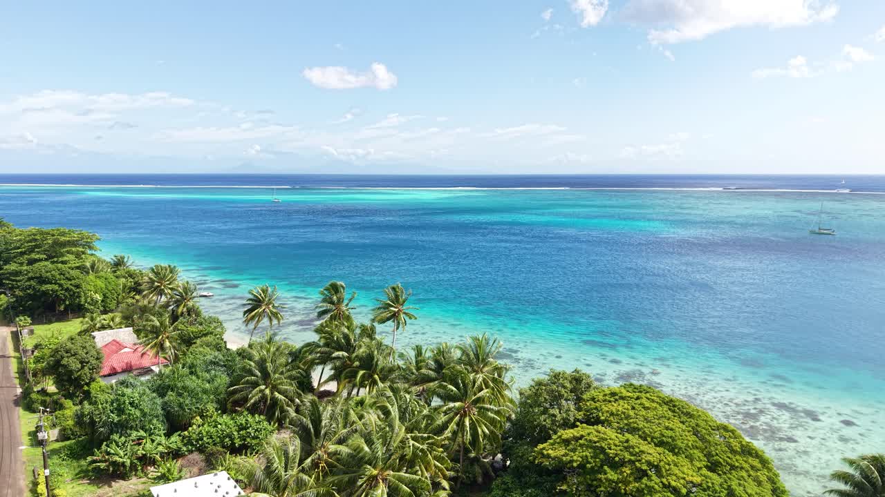 French Polynesia Tropical Paradise. Drone Shot of Turquoise Lagoon and Beachfront Homes in Breathtaking Scenery