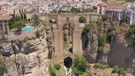aerial views of a spanish city, bridge, and canyon