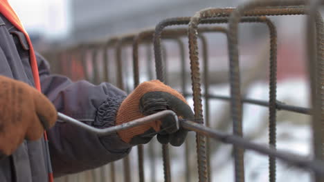 construction worker installing reinforcement bars