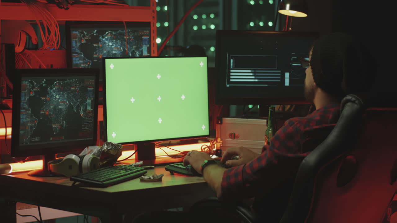 Hacker working in a dark server room