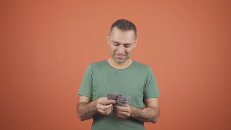 rich businessman counting money.