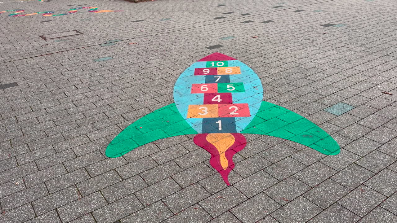 Kids playground in the public square, numbers can be seen on a painted bird