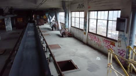 inside abandoned factory with conveyor belt building full of graffiti montreal canada