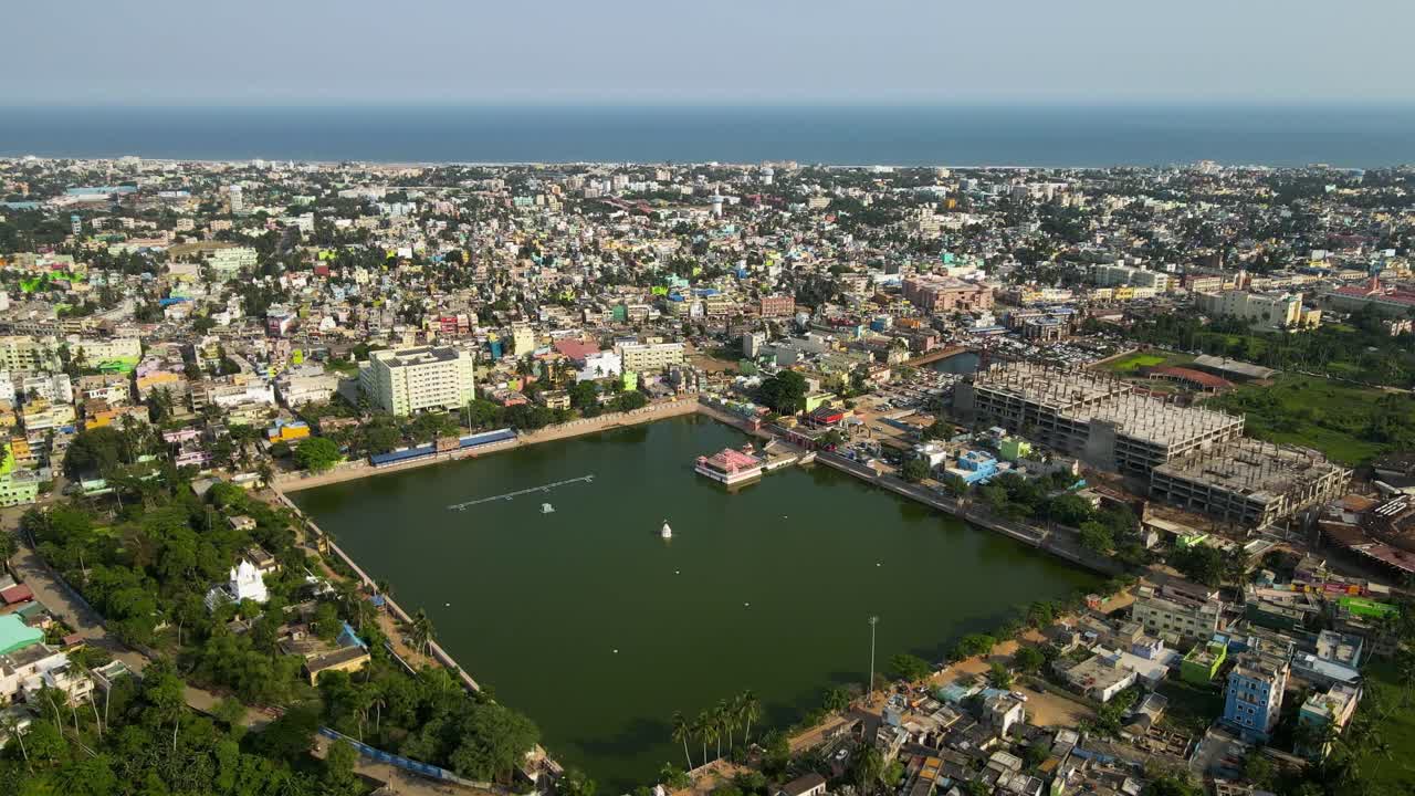 Aerial drone shot of Jagannath Puri, capturing the harmony between the historical temple and the modern cityscape.