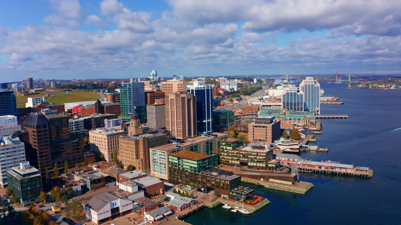 Aerial drone shot over Halifax downtown, Nova Scotia, Canada.
High view of the cityscape, ocean and the urban buildings.