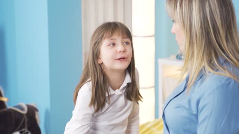 loving mother talking to her little daughter at home. mother daughter chat.