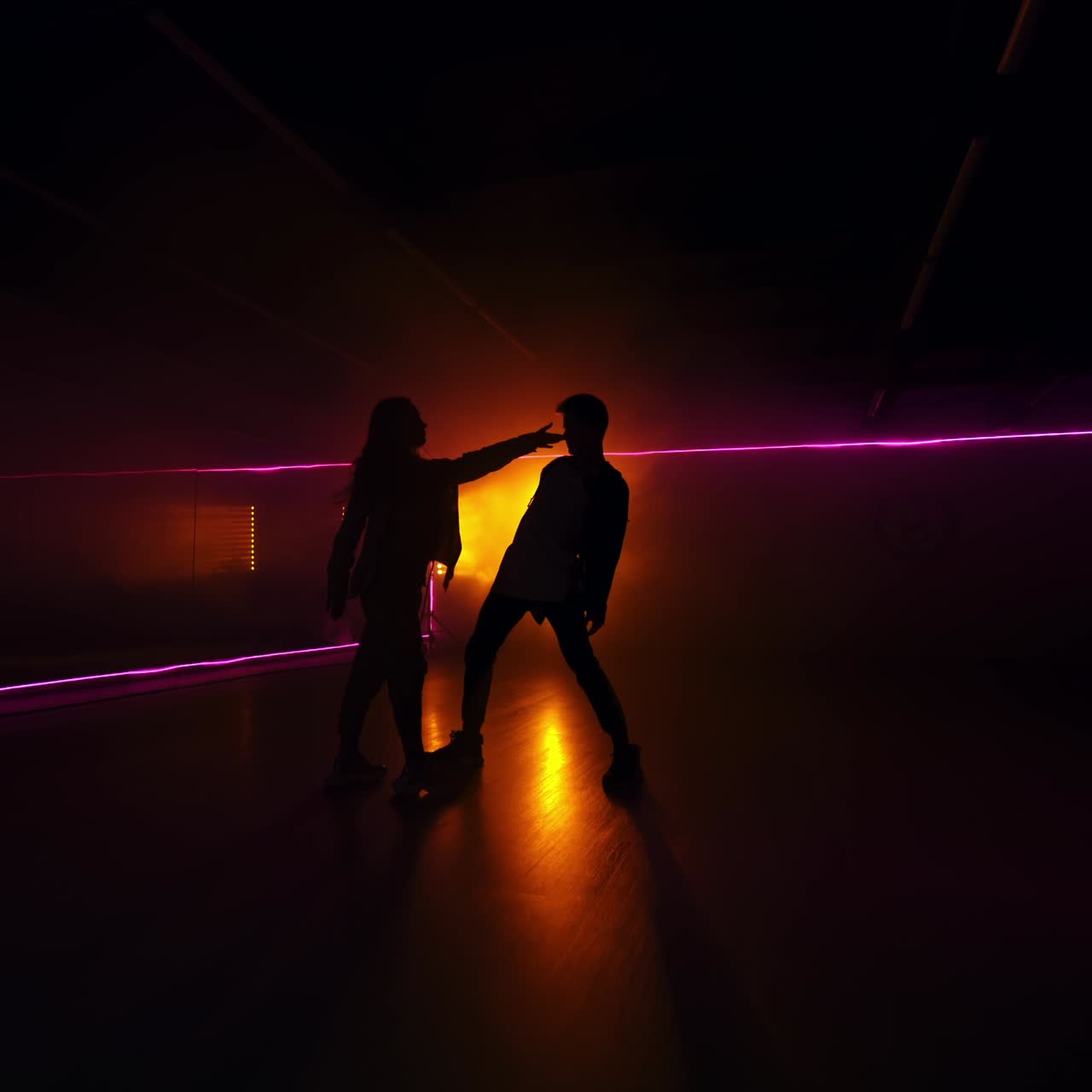 Stylish silhouette dancers. Dark shadows couple modern dancing