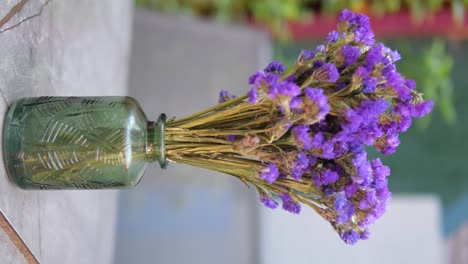 purple flowers in a green vase