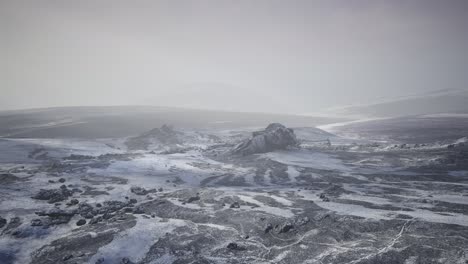 antarctic mountains with snow in fog