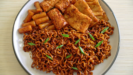 jajangmyeon or jjajangmyeon with odeng and omuk - korean instant noodles with korean fish cake in black bean sauce - korean food style