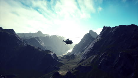 helicopter flying over mountain range