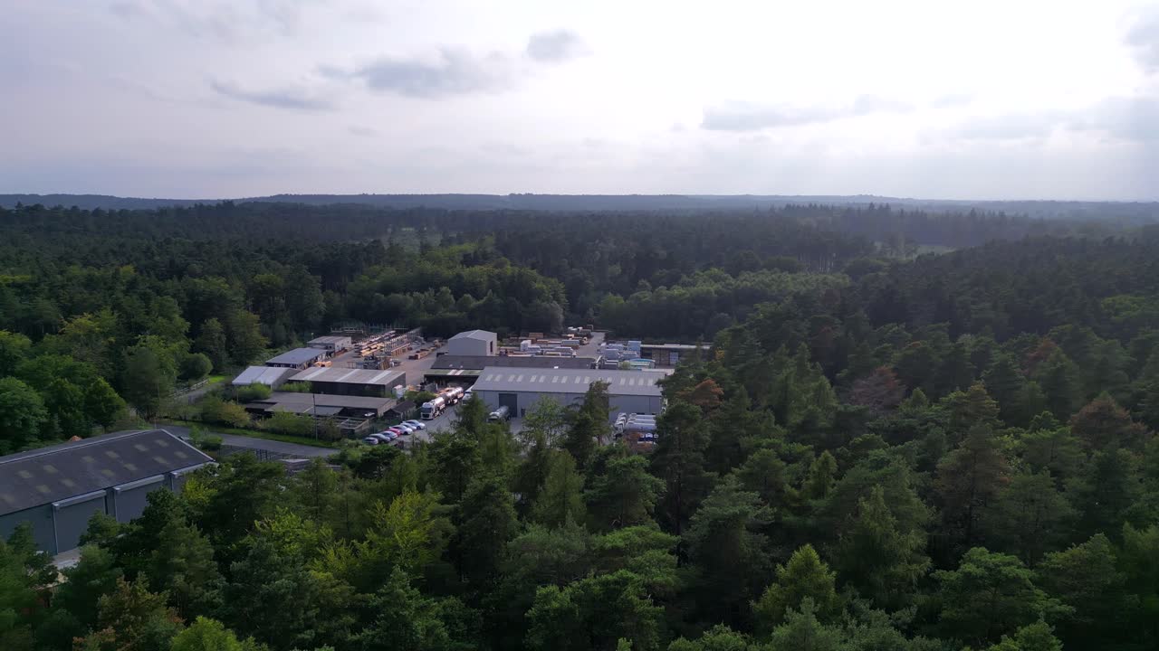 Aerial 360 view of factory complex surrounded by dense forest in Ascot