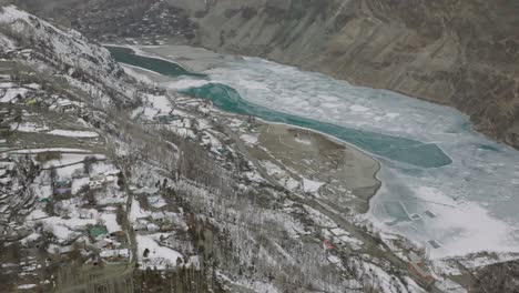 cinematic aerial view of frozen khalti lake in gupis-yasin valley