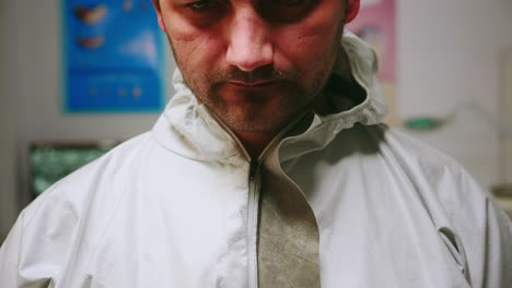 close up of tired pediatric dentist man with marks on face