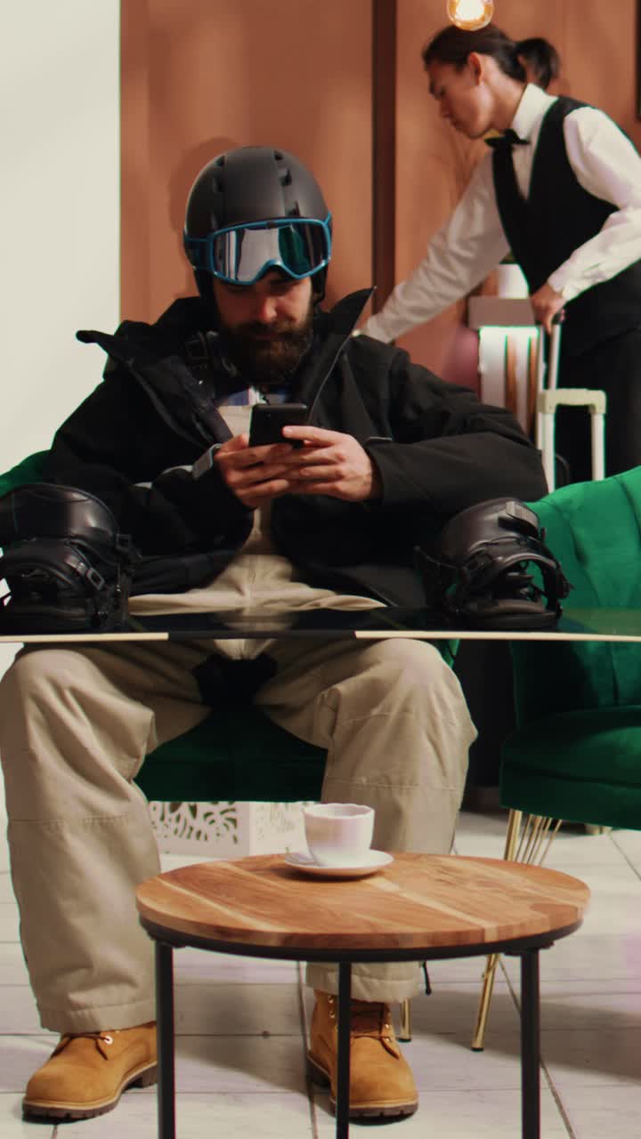 Vertical Video Traveller texting messages before skiing