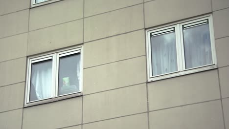 close up of condominium facade and closed windows