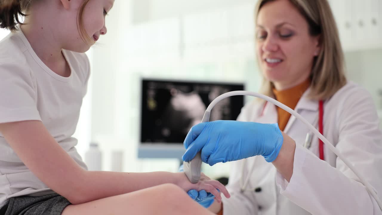 Doctor Performing Ultrasound on Child