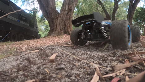 remote-controlled truck doing burnouts in the dirt in slow motion