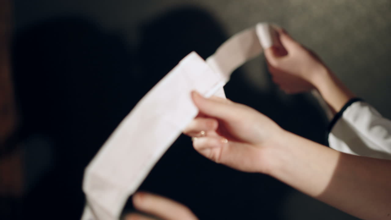 Electrocardiogram, ecg in hand, palm of a doctor. Clinic cardiology heart rhythm and pulse test closeup. Cardiogram printout.