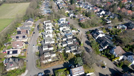 aerial of white houses in suburban neighborhood