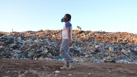 asian boy in protective mask walking in environmental pollution, slow motion