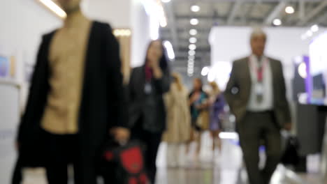 blurred image of people at a business exhibition