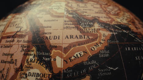 close up of a vintage world globe, focusing on the middle east