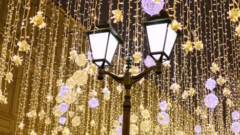 street lantern with decorative christmas garlands. new year and christmas celebration.