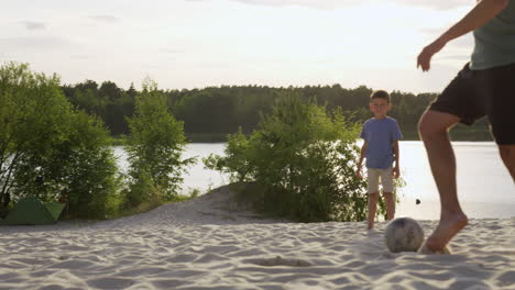 Father-and-sons-playing-on-the-beach