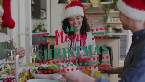 merry christmas text animation over people enjoying festive meal in kitchen
