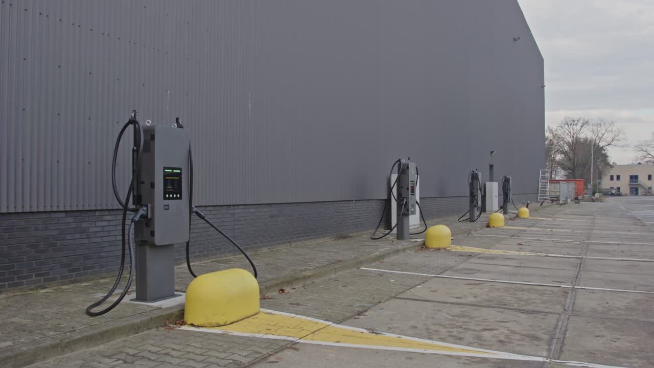Dolly out of several Electric Vehicle charging stations on an industrial parking lot