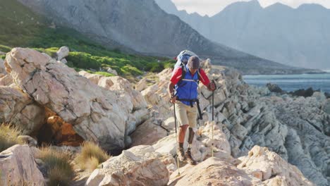 Sporty-mixed-race-man-with-prosthetic-leg-hiking