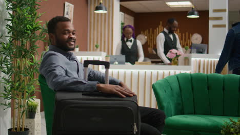 African-american-guest-sit-in-lobby