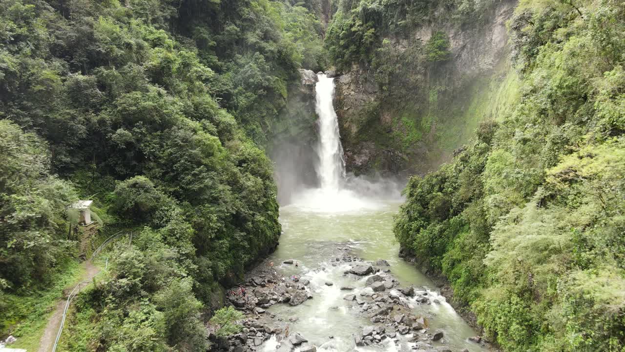 Aerial view of powerful Waterfall cascading into a river gorge, surrounded by dense tropical rainforest in Northern Luzon, Philippines. Majestic Tappiyah Falls in Banaue, Ifugao