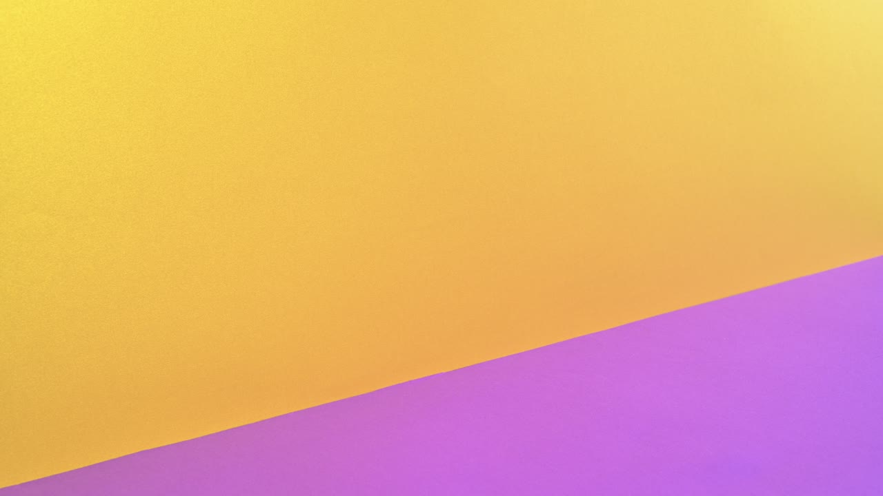 Vintage pastel hardcovered books appear and one golden open on golden purple theme. Stop motion animation