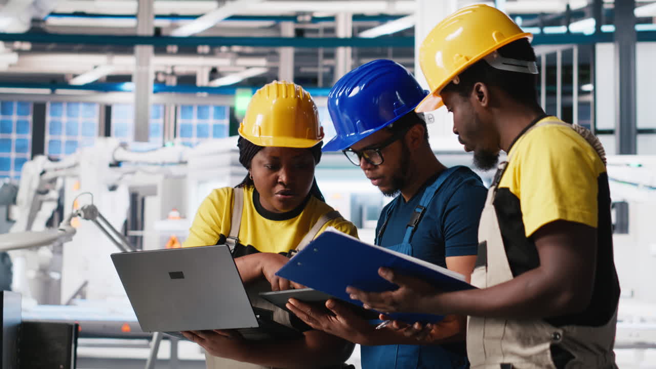 Vertical Video Technicians group in photovoltaics factory use tracking software on devices