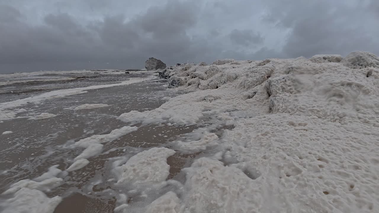 Sea Foam With Wind Blowing On Cloudy Day. Cyclone Alfred At Currumbin Beach In Gold Coast, Queensland. static shot