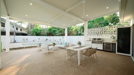 outdoor patio in a luxury small home, perfect for relaxation, featuring modern furnishings and landscaping