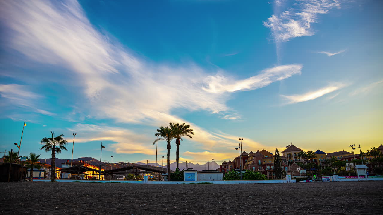 Timelapse from Benalm&aacute;dena Beach with Blue Sky, Clouds, Palm Trees, and Hotel