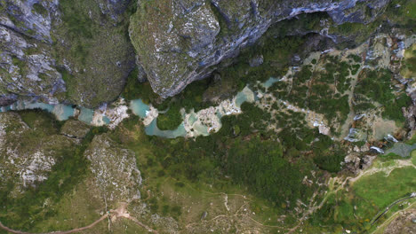 beautiful drone shot of the turquoise waters of millpu, ayacucho, peru during a cloudy day