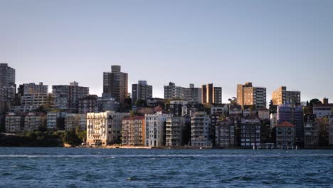 cityscape with residential buildings along a waterfront