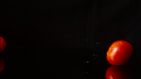 tomatoes water splash in super slow motion