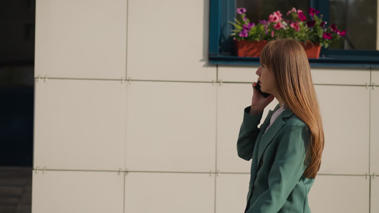 Discontented female talks on phone with husband angrily